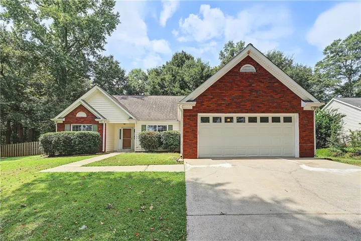 Brick and siding exterior with a two-car garage