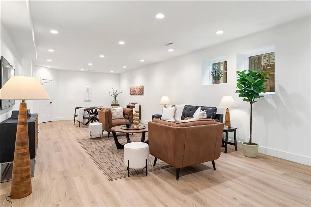 Living area with recessed lighting and light wood-style floors