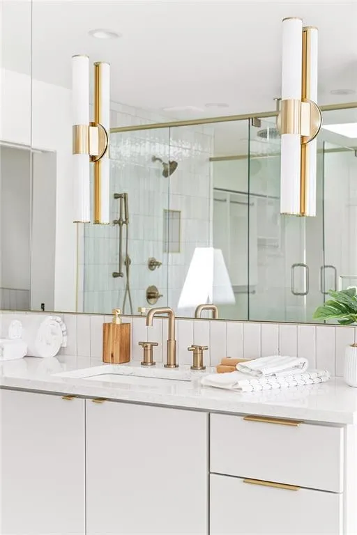 Full bath featuring vanity and a stall shower