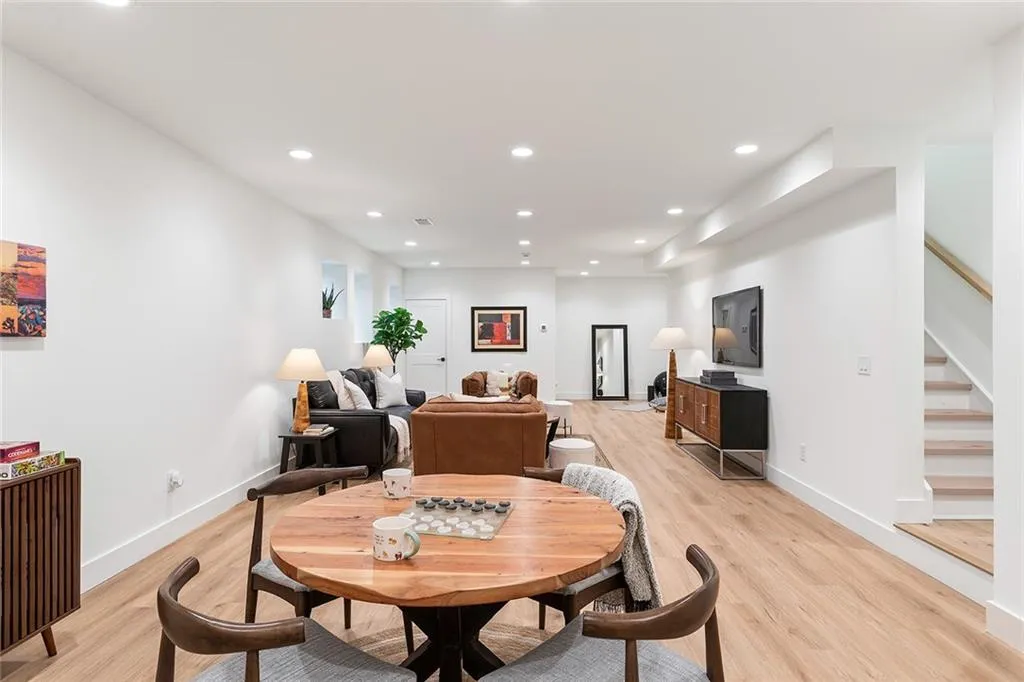 Dining room featuring recessed lighting, stairway, and light wood finished floors