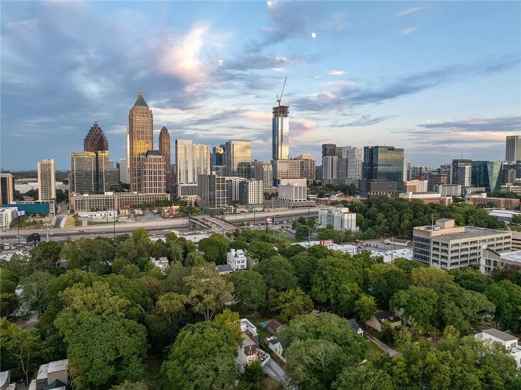 View of city skyline with a tree filled landscape