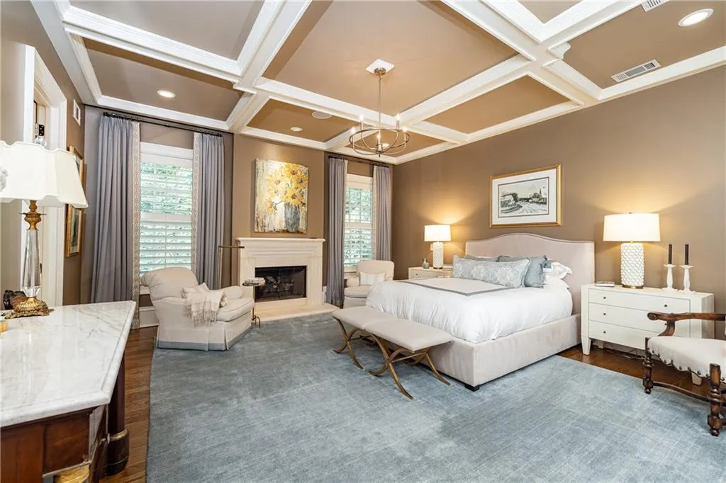 fireplace with gas logs and coffered ceiling