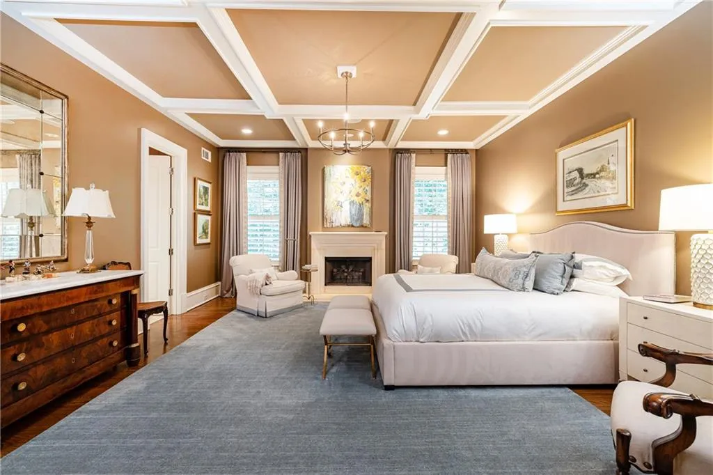 fireplace with gas logs and coffered ceiling