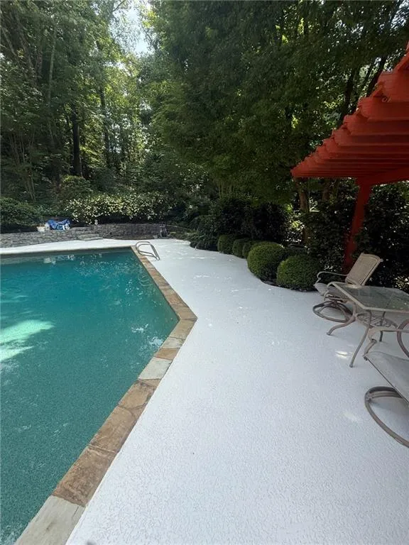 Outdoor pool with a patio