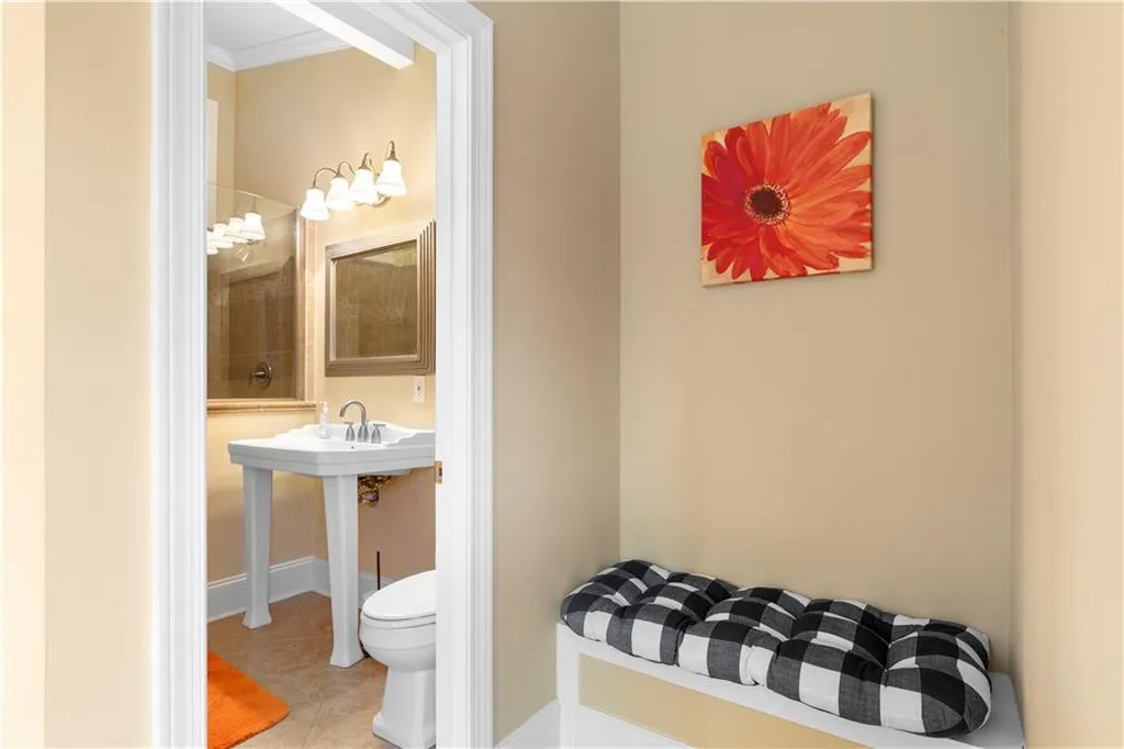 Third full bathroom on main level and pool drops off area