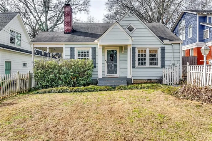 View of front of property with a front yard
