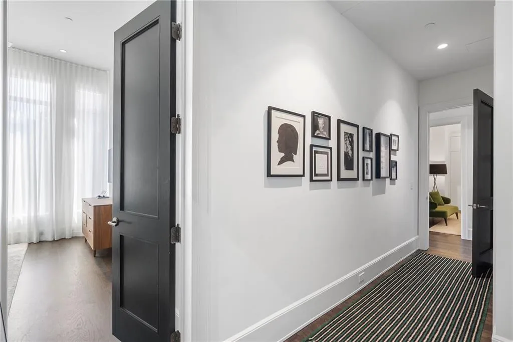 Corridor featuring recessed lighting, baseboards, and wood finished floors