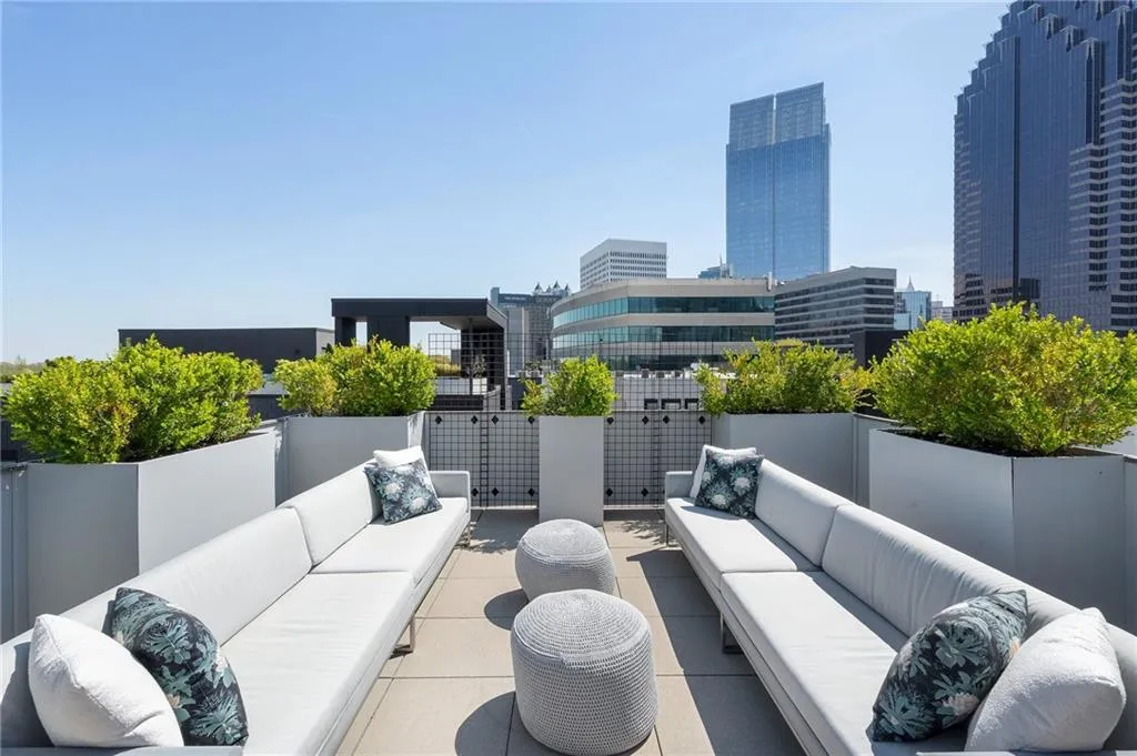View of patio featuring an outdoor hangout area and a view of city