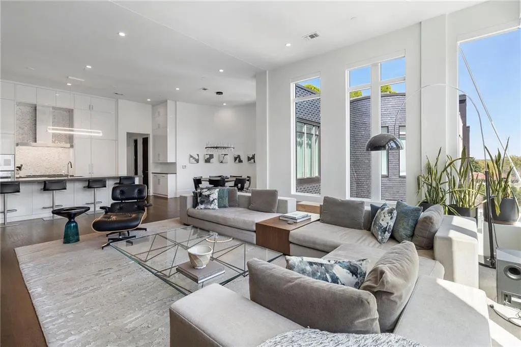 Living room featuring visible vents, wood finished floors, and recessed lighting