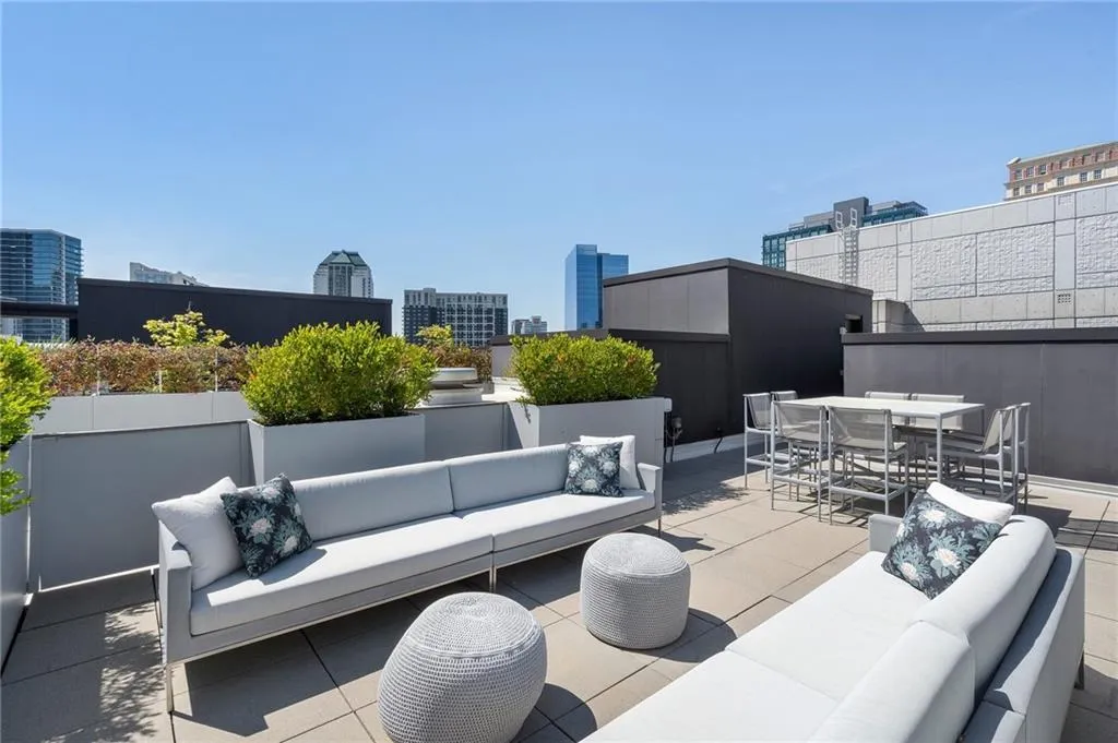 View of patio / terrace with an outdoor hangout area, outdoor dining area, and a view of city