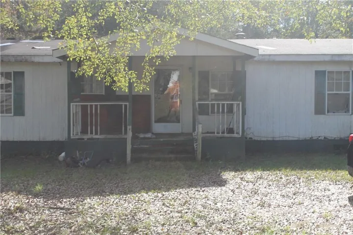 Property entrance featuring a covered Porch