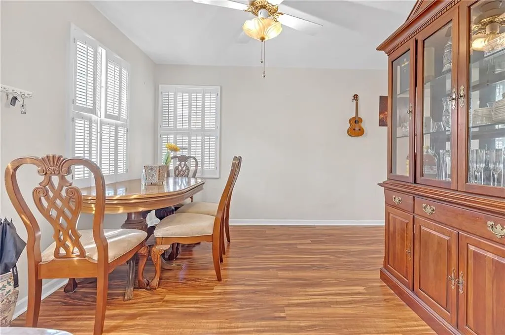 Dining space featuring light wood-style flooring and ceiling fan