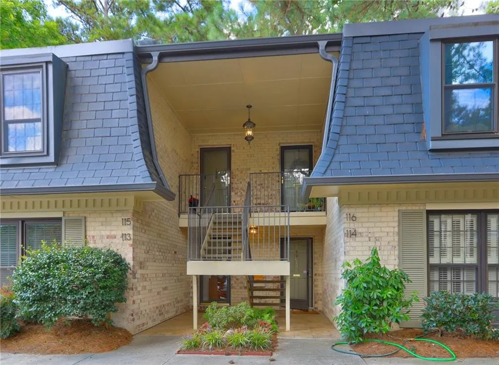 View of property with stairs