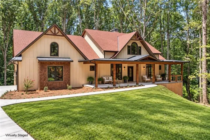 Craftsman-style exterior with a covered porch featuring exposed wood beams and posts