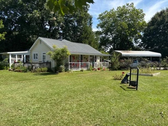 THIS HOME HAS LOW MAINTENANCE VINYL SIDING. IT HAS A DETATCHED AWNING LARGE ENOUGH FOR 2 CARS TO PARK UNDERNEATH IT. THERE IS A GREAT FRONT PORCH FOR RELAXING IN THE EVENINGS.