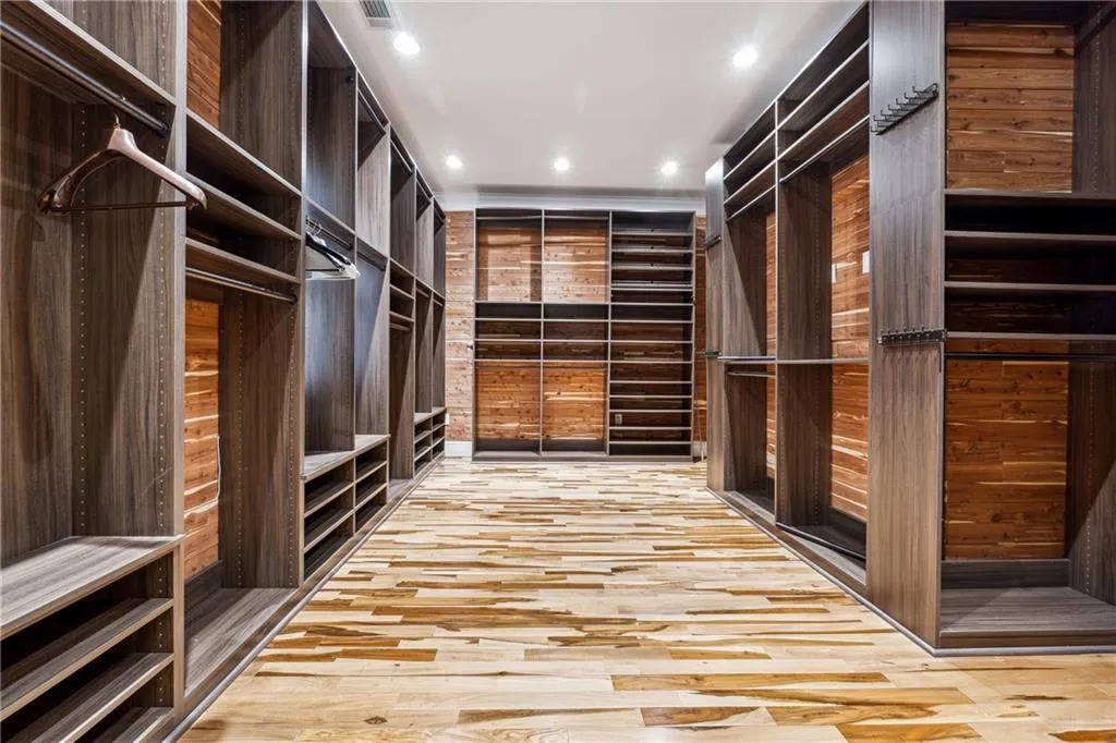 Walk in closet featuring light hardwood / wood-style flooring