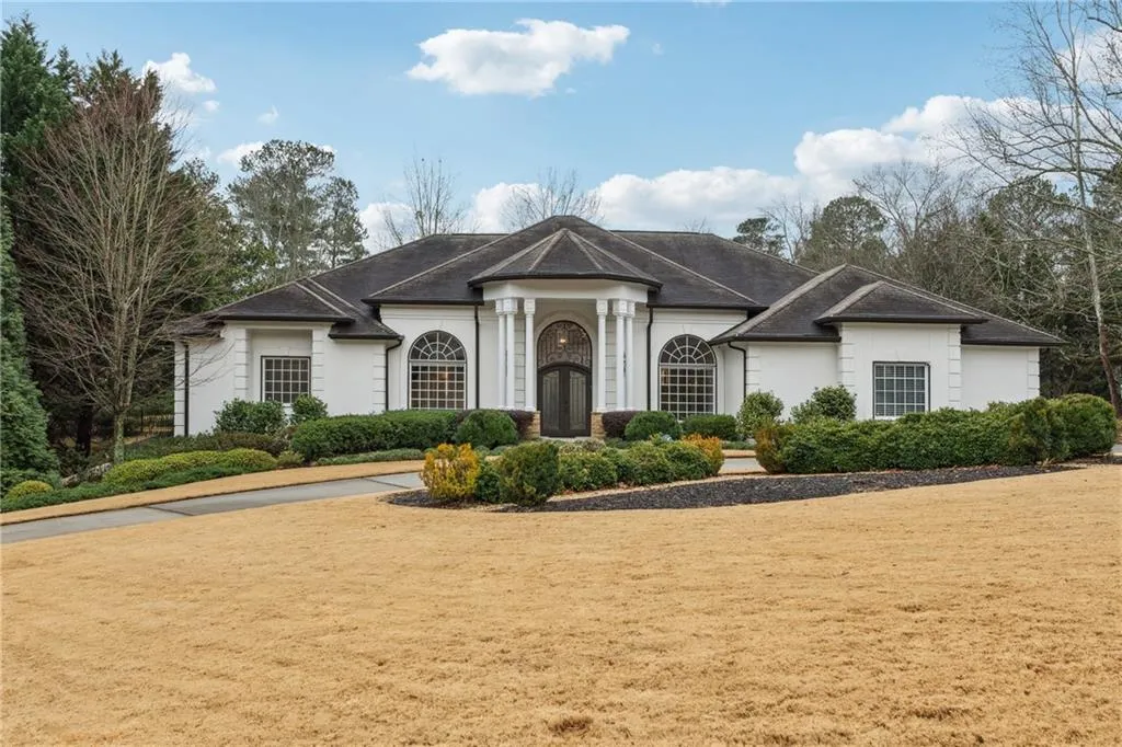 View of front of property with a front yard