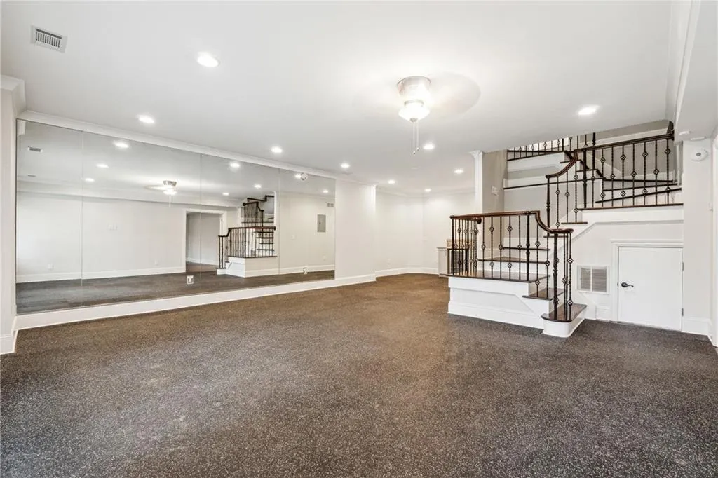 Unfurnished living room with crown molding