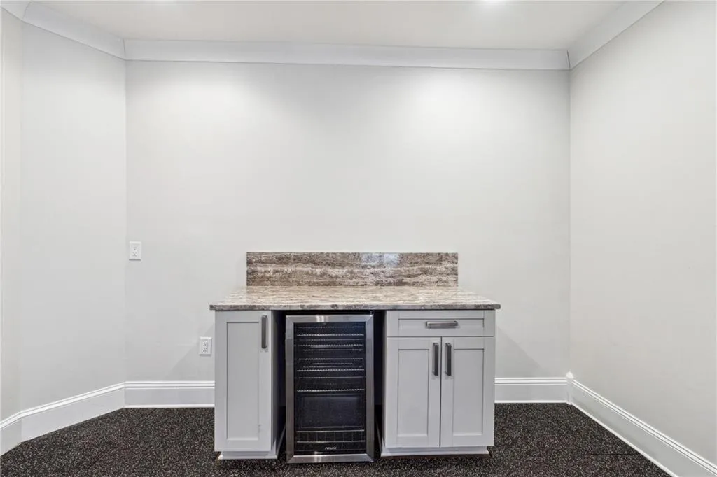 Bar with ornamental molding and wine cooler