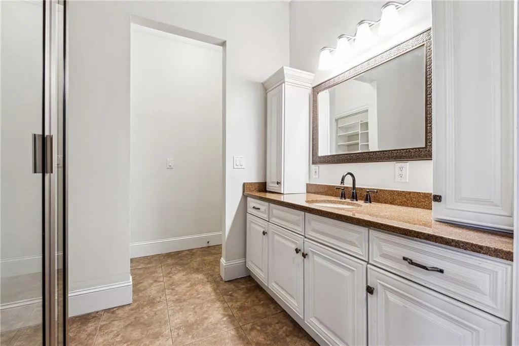 Bathroom with vanity and tile patterned floors