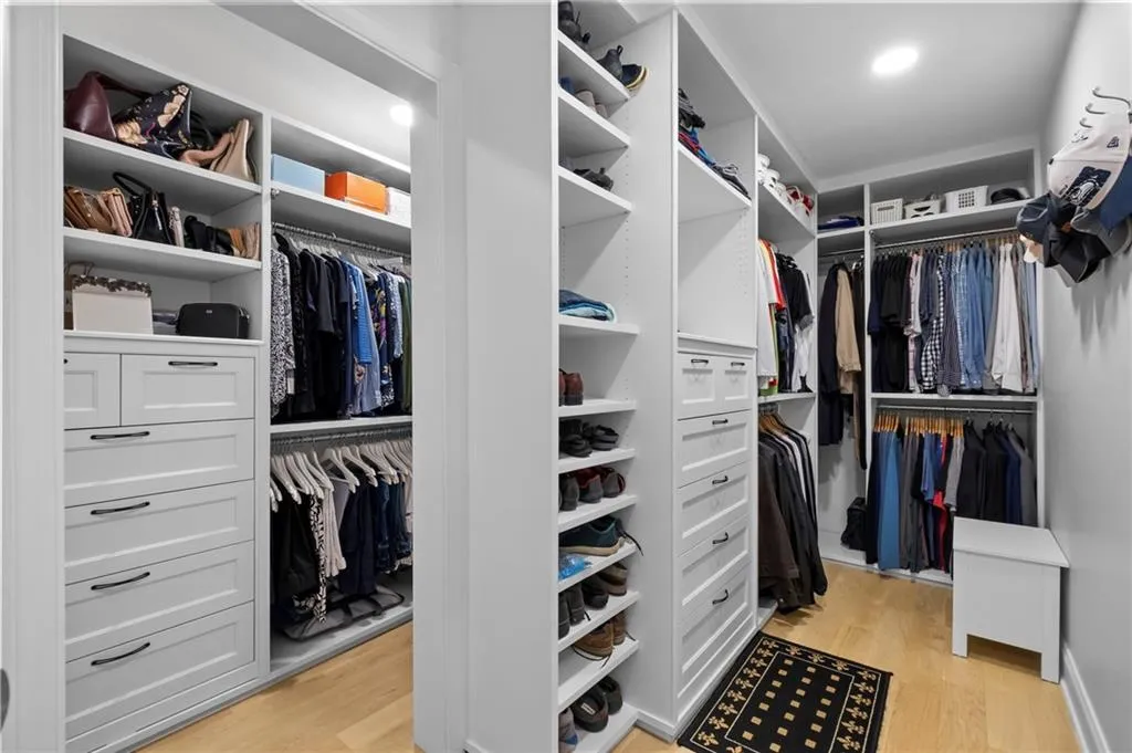 Walk in closet featuring light wood-style floors