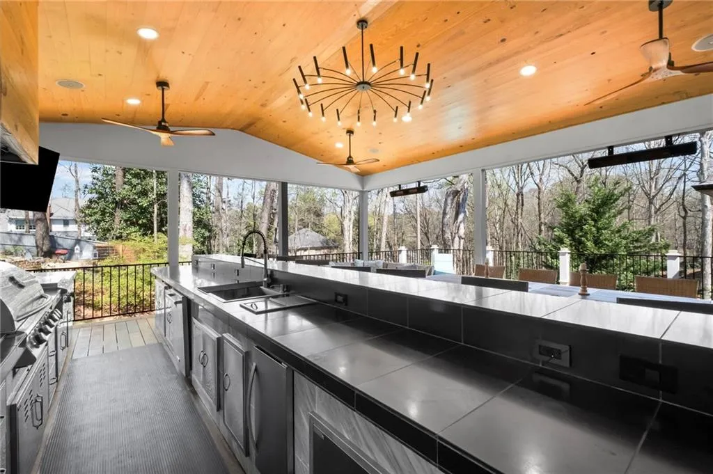 View of patio featuring ceiling fan and an outdoor kitchen