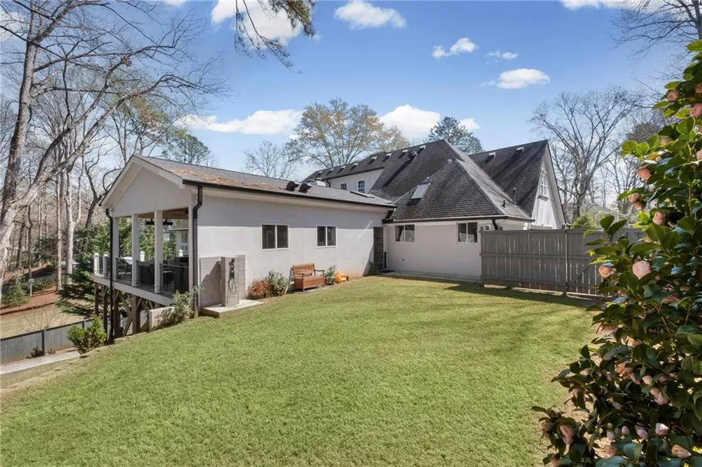Rear view of house featuring stucco siding