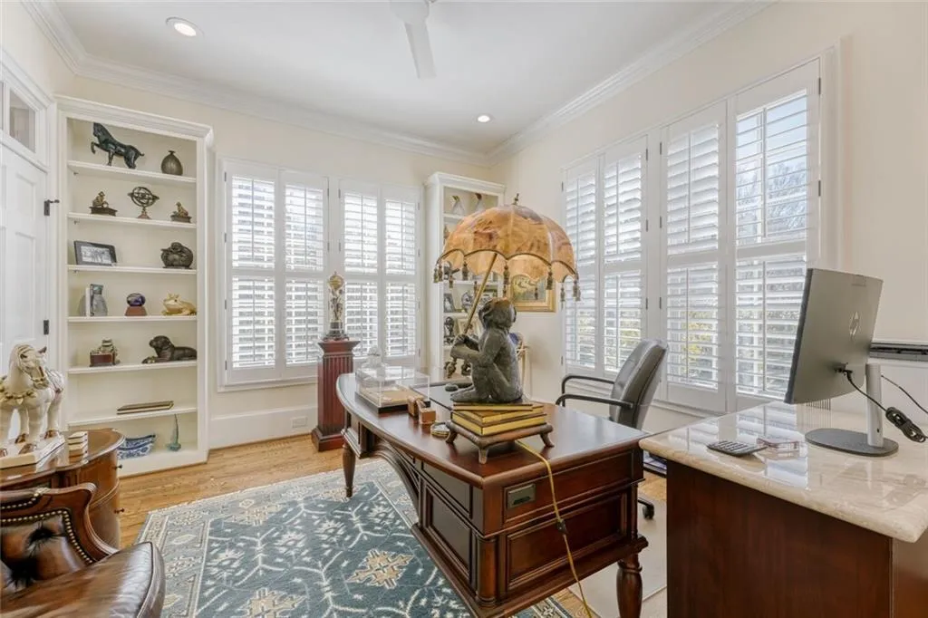 Study on main level has shutters, built in cabinetry and extra storge.