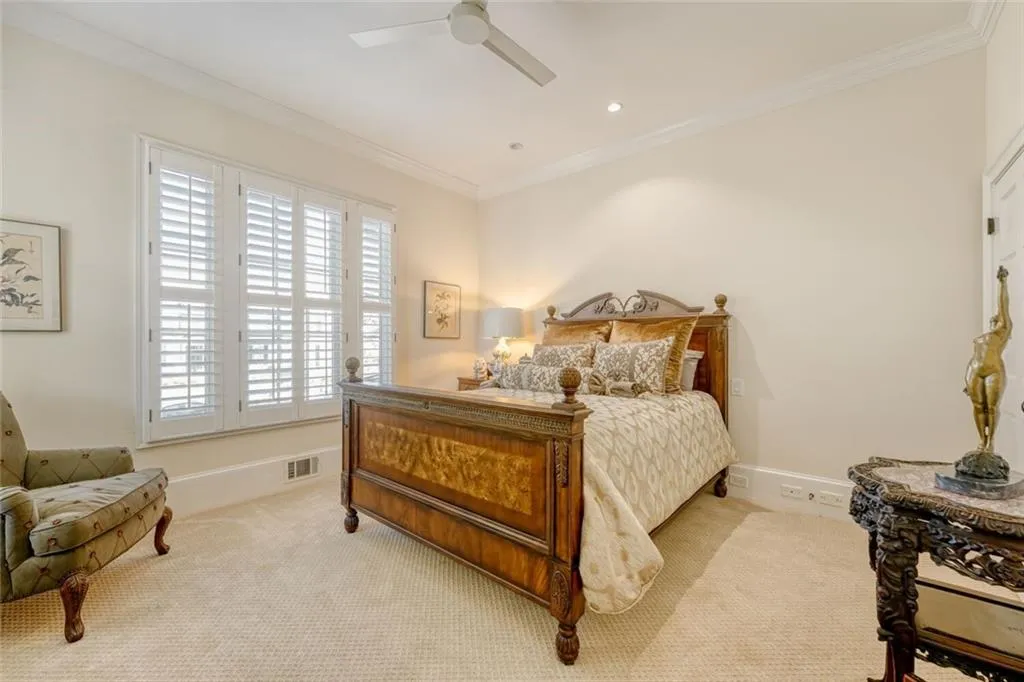Main level guest bedroom has sitting area, walk in closet and full bathroom.