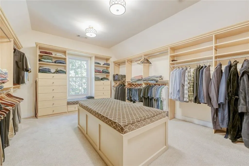 Primary closet has ample space.