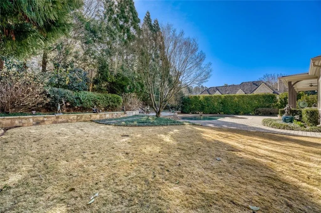 Manicured grounds surround the home.