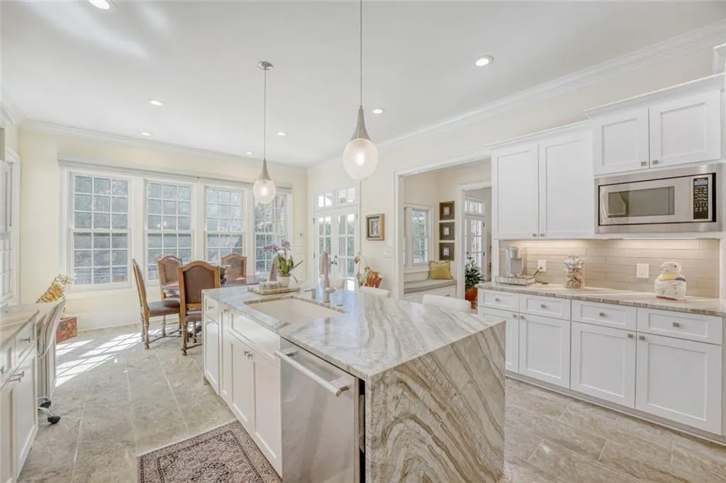 Spacious island with integral sink and dishwasher.