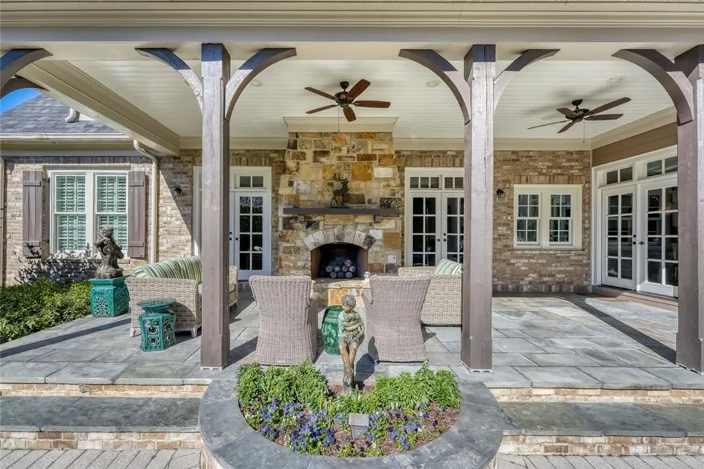 Outdoor fireplace completes the covered patio