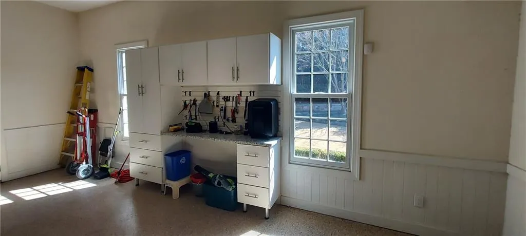 Terrazzo epoxy finish on garage floor. Space for a workbench and plenty of room for a project or tool storage.