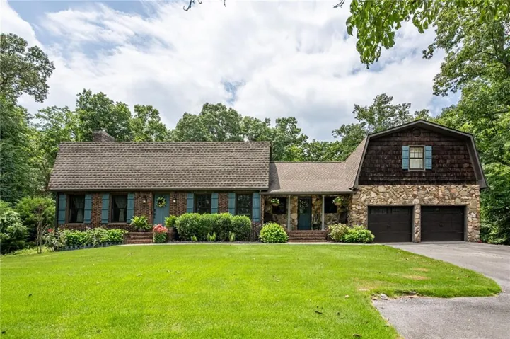 Brick and stone-clad exterior with a two-car garage