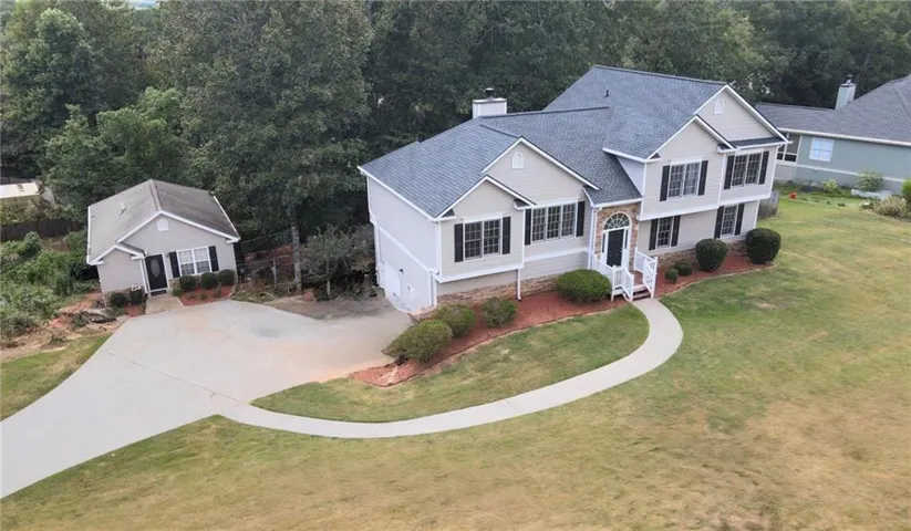 Two-story home with a one story cottage.