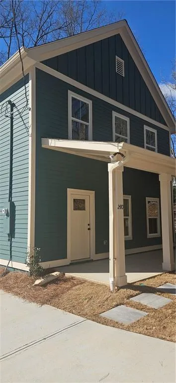 View of front of property featuring a porch and board and batten siding