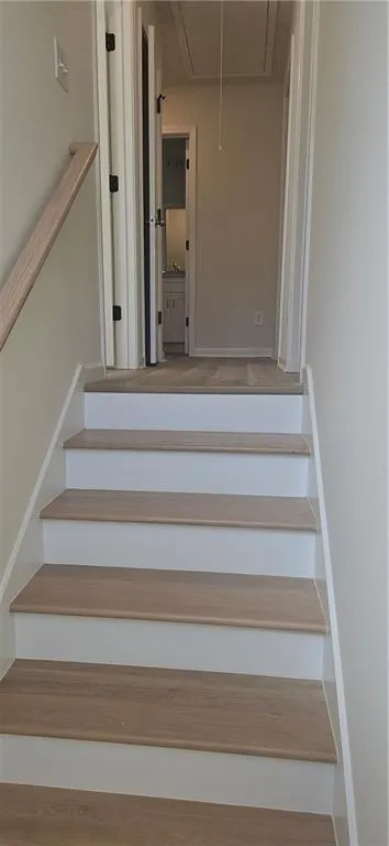 Stairway with attic access and baseboards