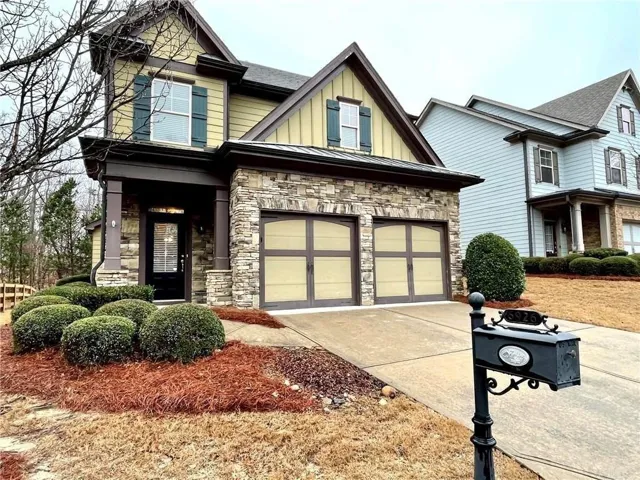 Stone and siding exterior with gabled roof lines