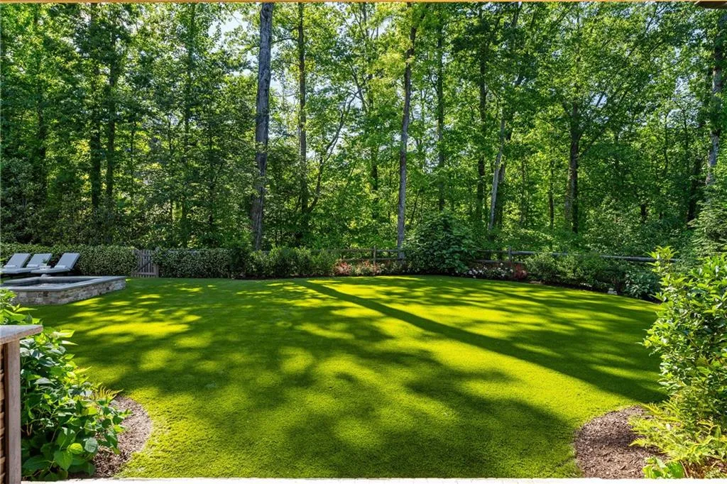 Beautifully landscaped private, level backyard
