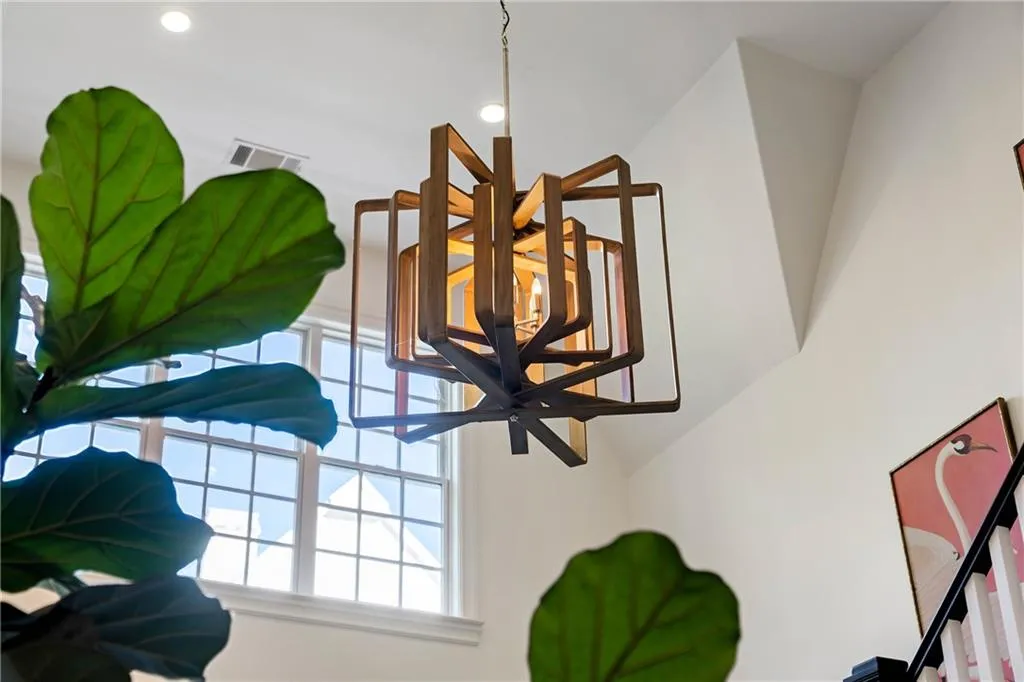 Two story foyer with gorgeous lighting