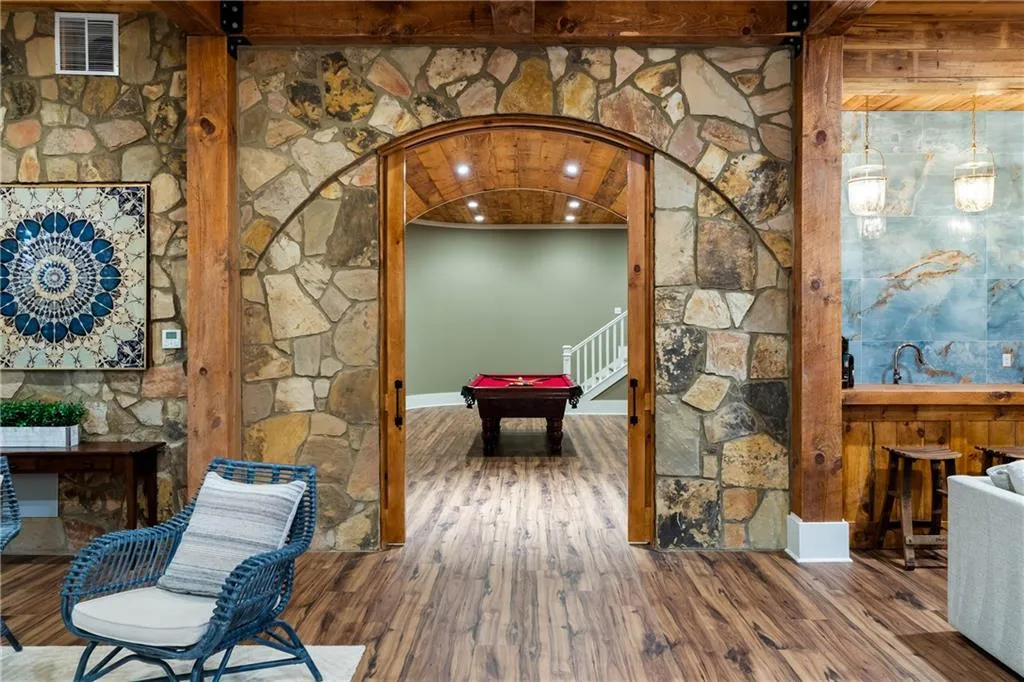 Pocket door entry to terrace level rec space, bar and wine cellar