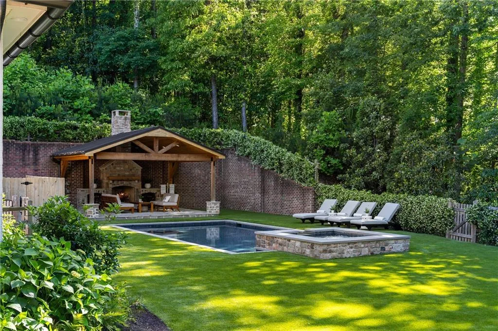 Saltwater heated pool, spa and pavilion with wood burning fireplace.