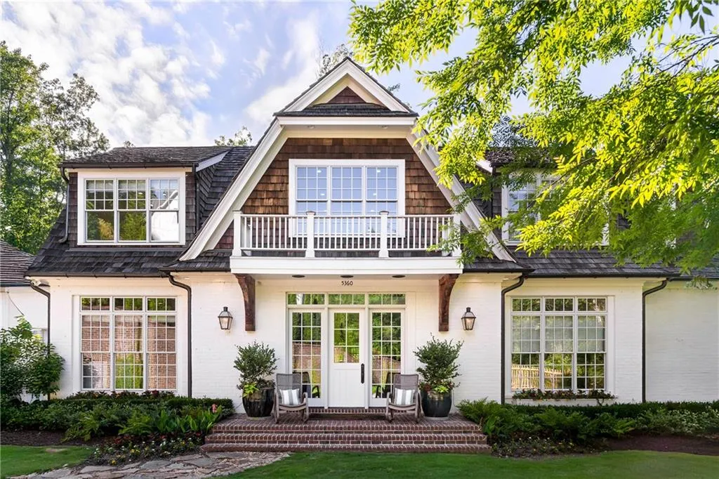 Nestled on over 3 acres in an executive four home community near Chastain Park.