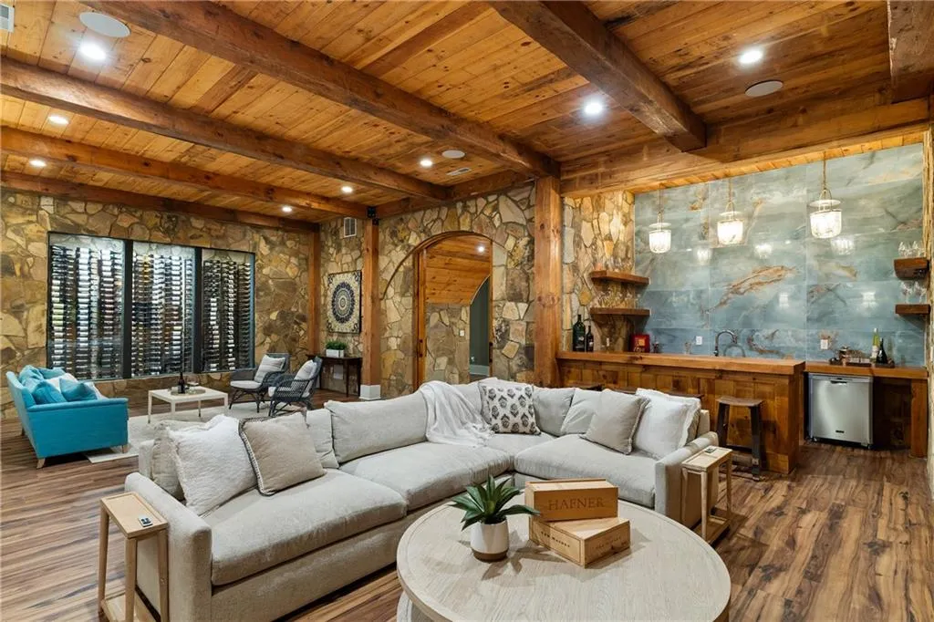 Finished terrace level with 1000 bottle collectors wine cellar, wet bar and rec space