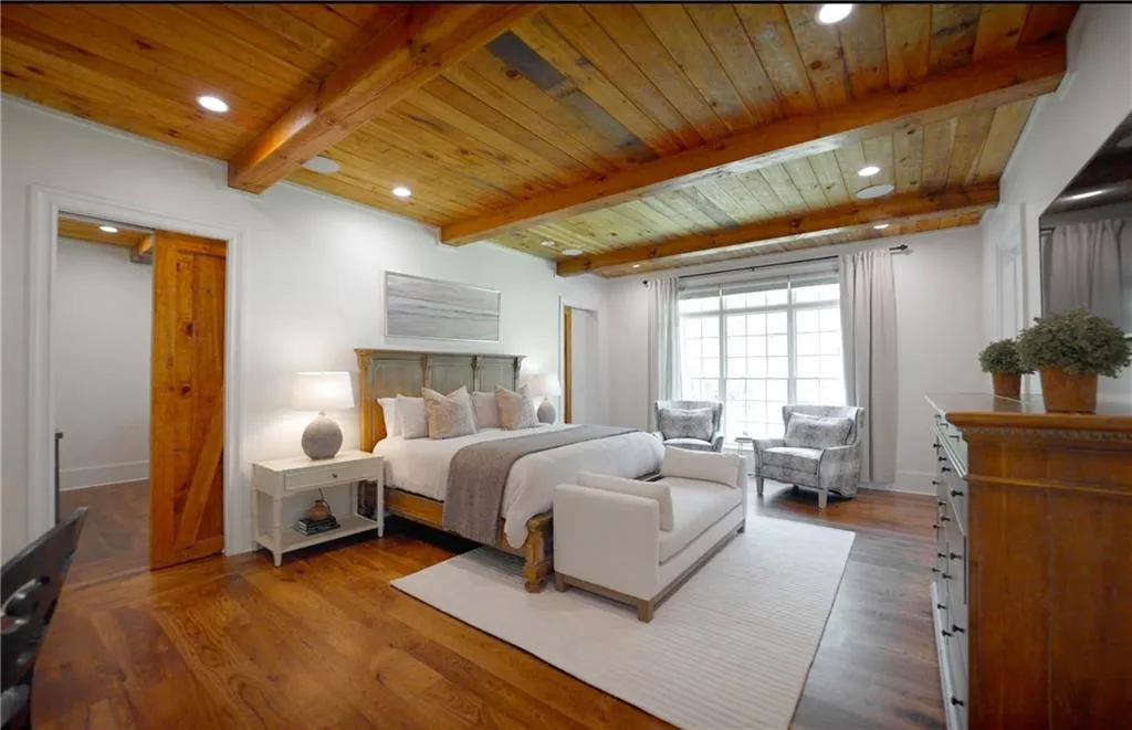 Primary bedroom suite with pocket doors leading to sitting room, also perfect for private home office or nursery