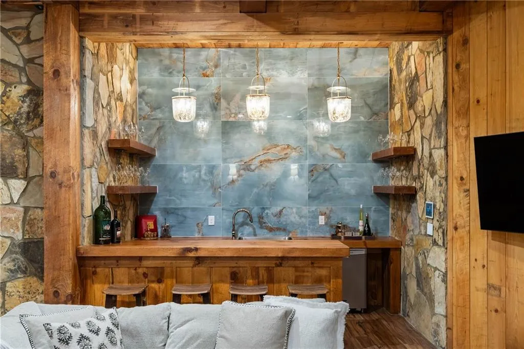 Wet bar with statement tile on terrace level