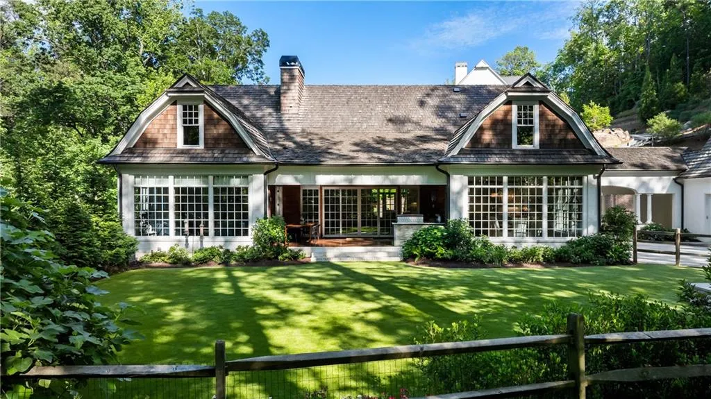 Walk out from main living area and covered patio to a private, fenced level backyard