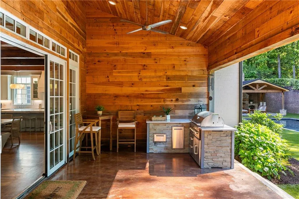 Outdoor kitchen on covered patio off main floor living area