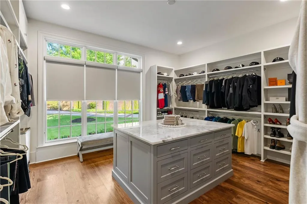 Custom closet with island in the primary bedroom